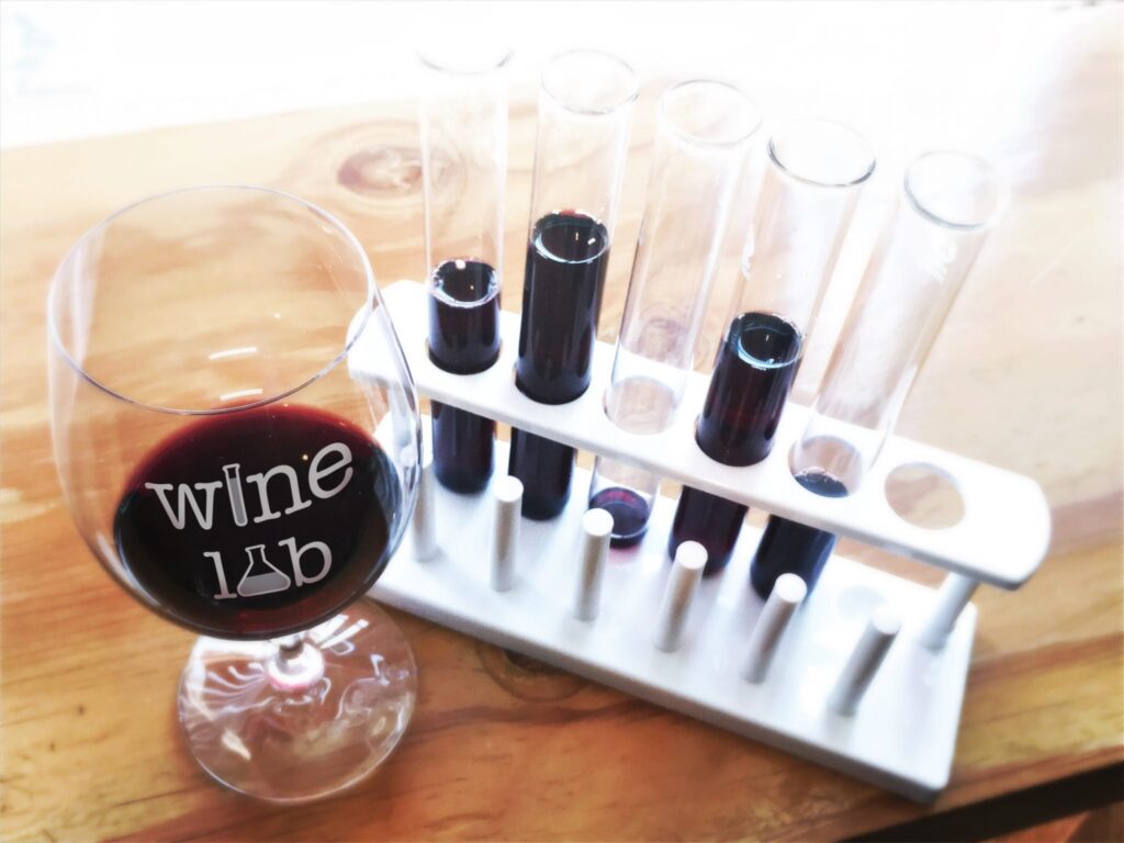 Wine Glass with tasting flight in test tubes